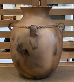 Micaceous Jar, Four Loop Handles and Carved Band At the Top with Three Pueblo Women 4”High the Jar is 13.75”High x 9.75”Diameter by Kathleen Wall - Jemez Pueblo